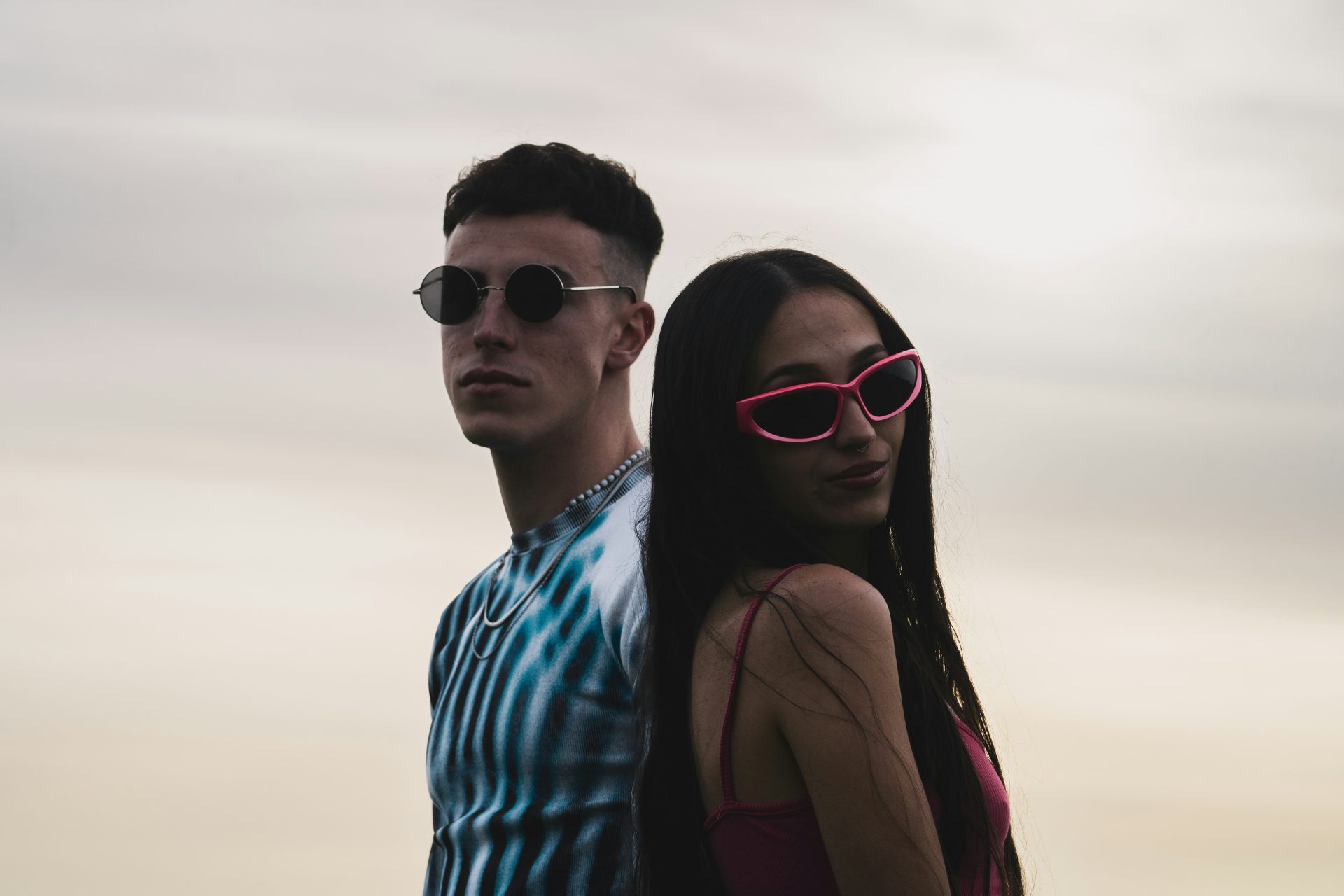 Couple in sunglasses posing together