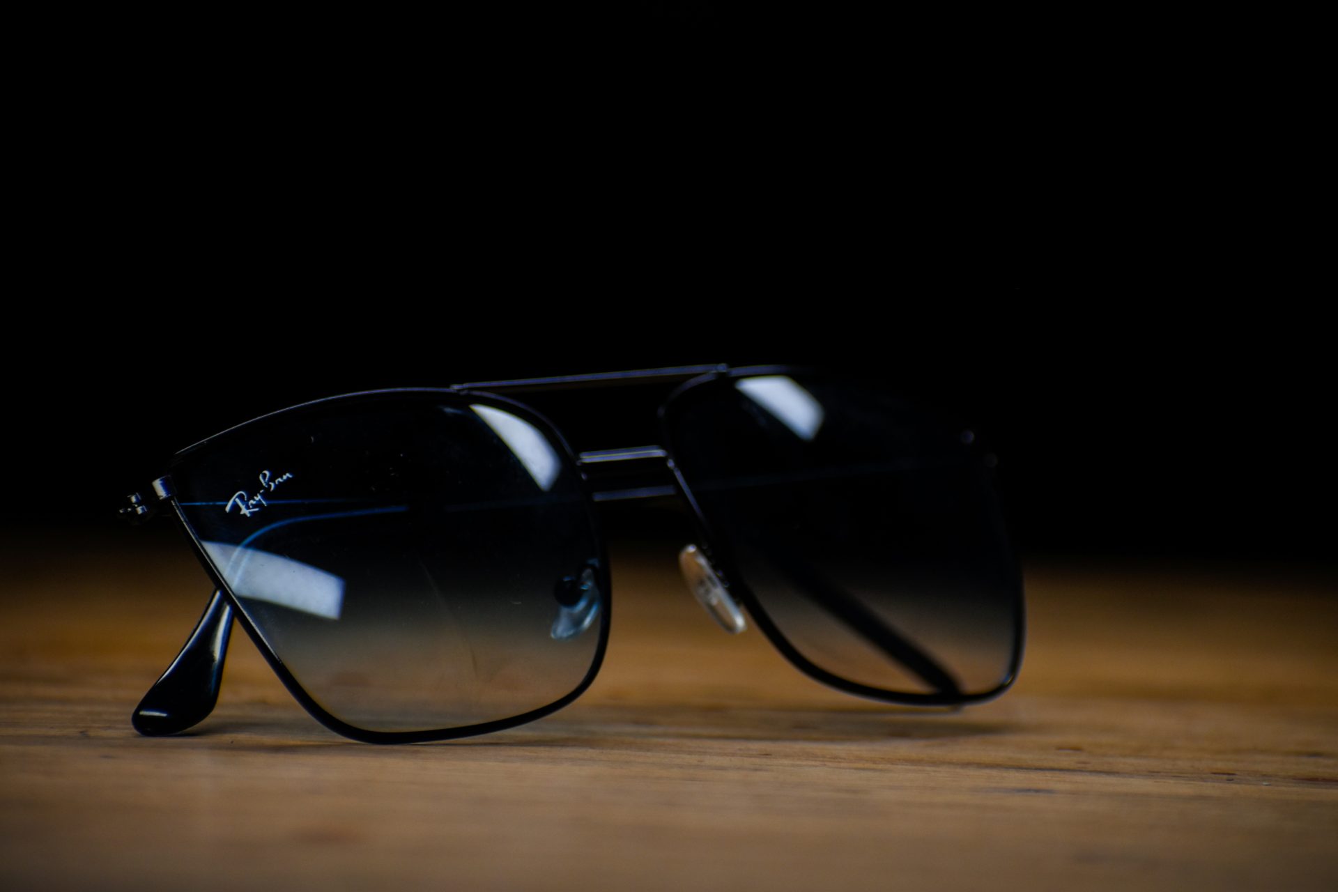 Sunglasses on wooden surface